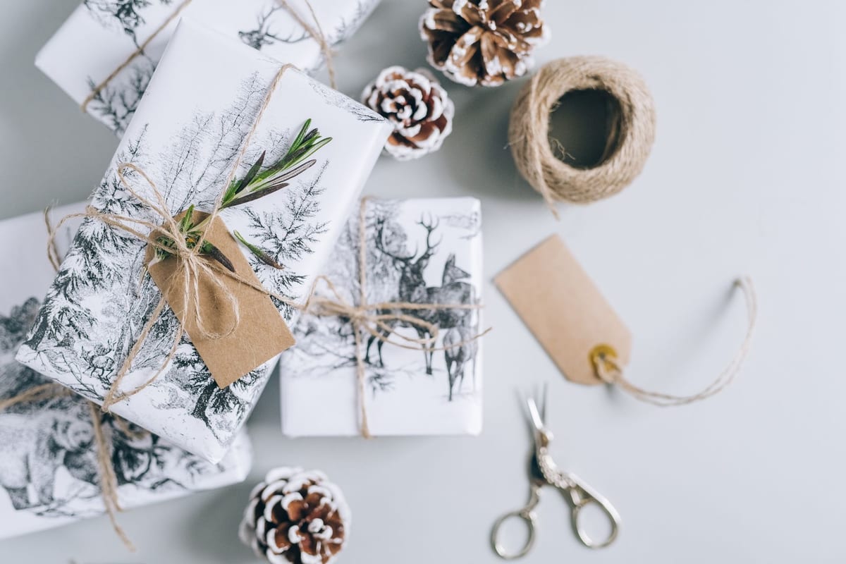 A neatly wrapped secret santa gift with a name tag